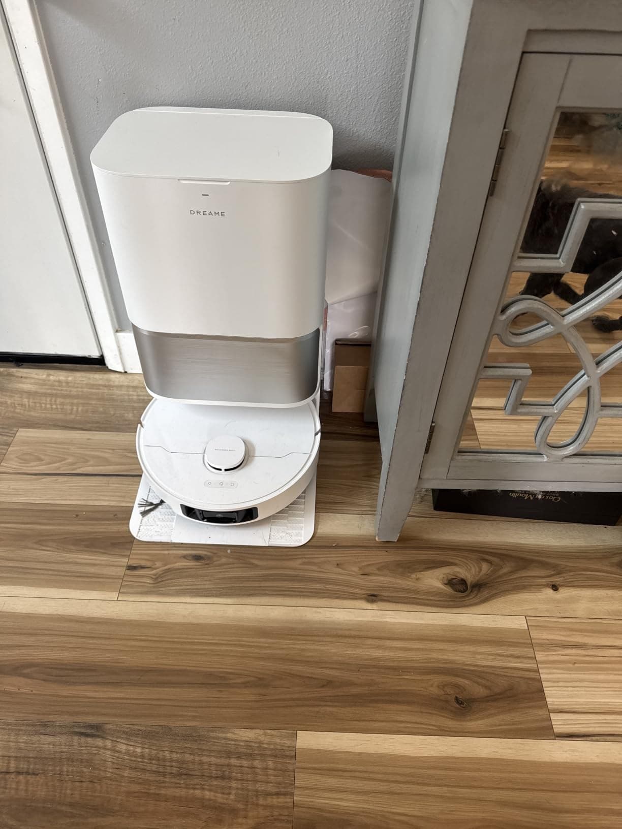 Dreame robot vacuum and self-emptying dock installed on a hardwood floor